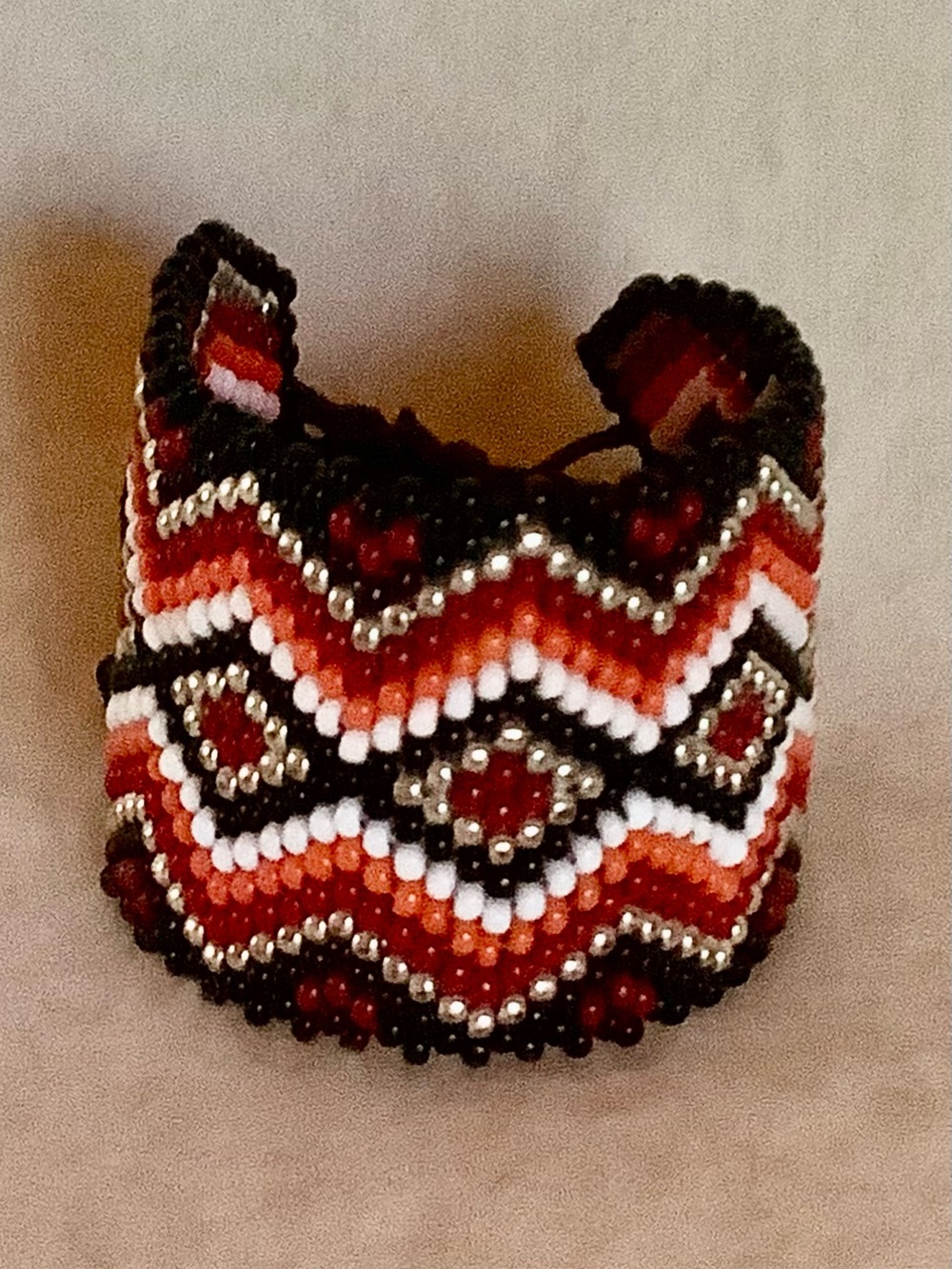 Handcrafted Beaded Cuff Bracelet — black, red, orange, white and gold